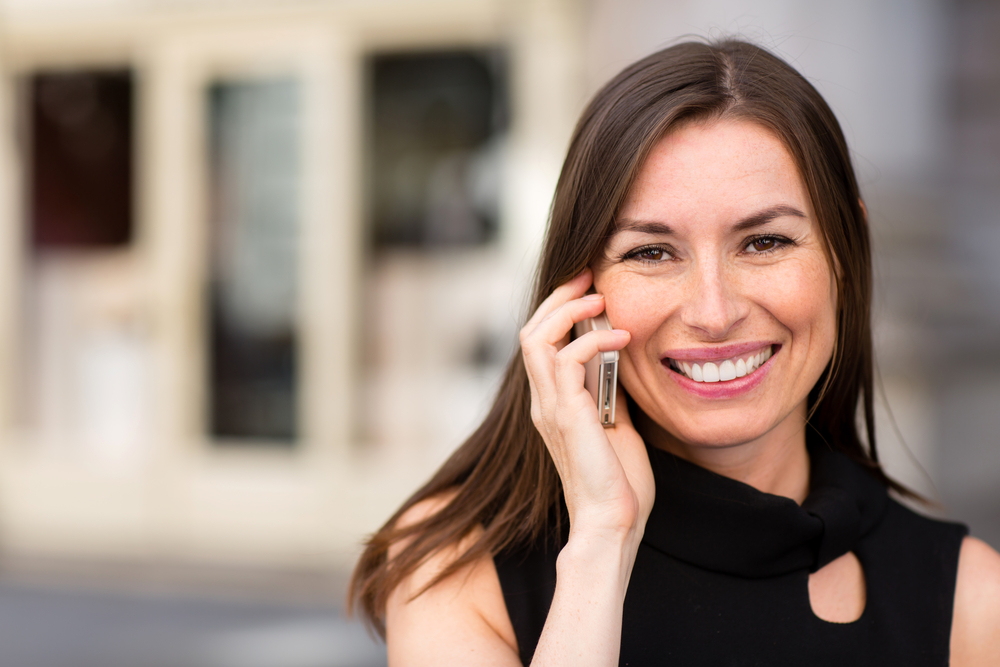 a woman talking to a financial advisor recruiting firm that works