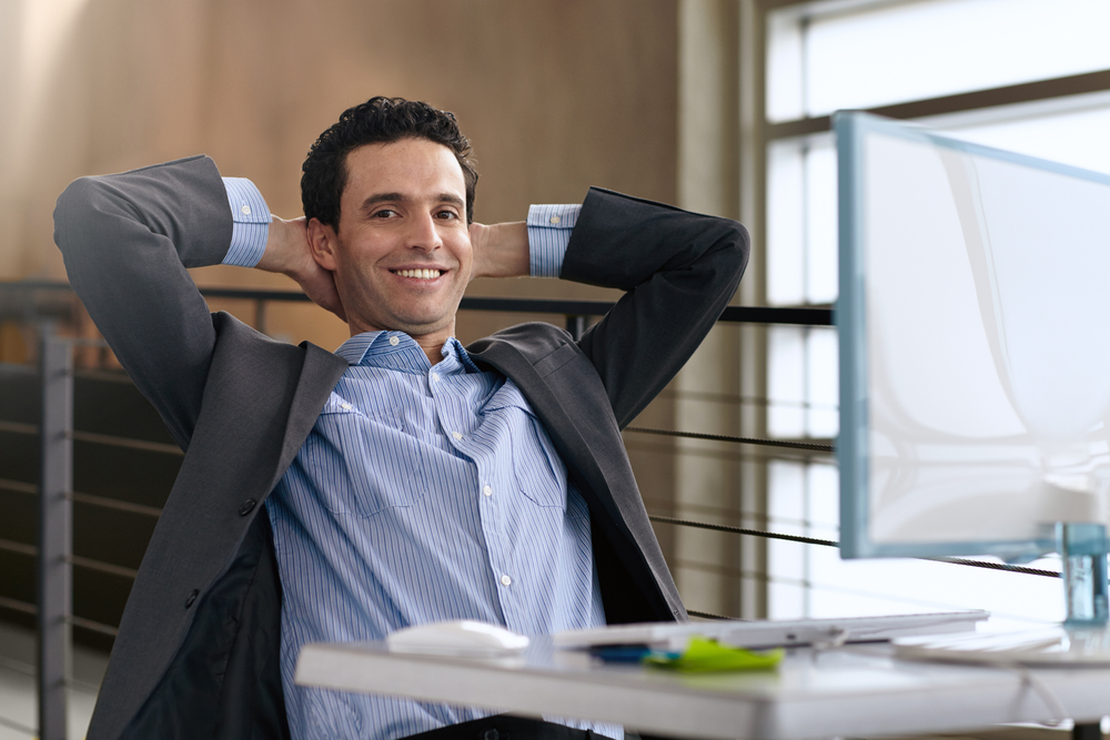 Portrait of a confident businessman at work in his glass office