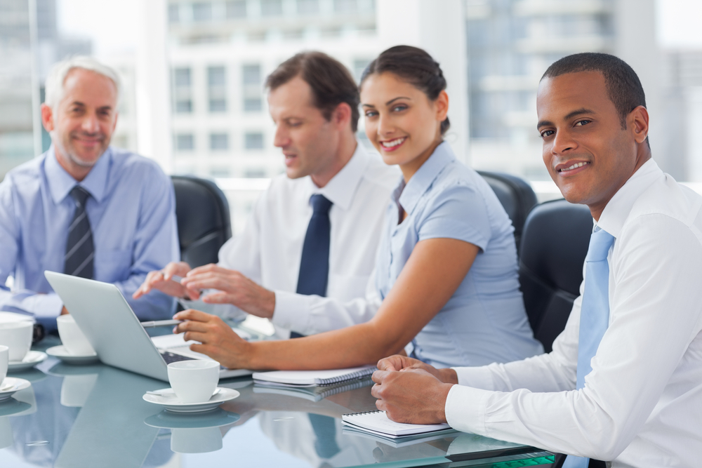 Smiling business people brainstorming in the meeting room